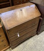 A George III mahogany bureau, with brass swing handles, on bracket feet, width 90cm, depth 50cm,