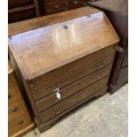 A George III mahogany bureau, with brass swing handles, on bracket feet, width 90cm, depth 50cm,