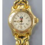 A lady's modern gilt steel Tag Heuer Professional quartz wrist watch, cased diameter 23mm, ex.