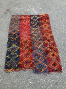 A Turkish wool rug, 187 x 114cm