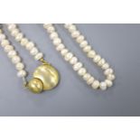 A modern single strand baroque pearl necklace, with yellow metal clasp, 45cm, gross 51.7 grams.