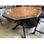 In the manner of Lamb of Manchester. An octagonal amboyna ebonised centre table, bear Southport