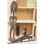 Ethnographia, a collection of various wood carvings, including an African tall female fertility