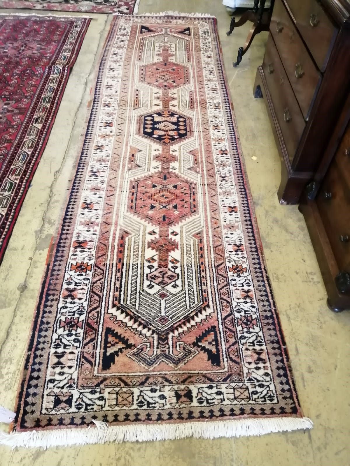 A Caucasian design ivory ground runner, 336 x 94cm