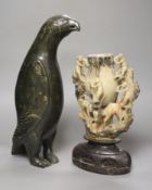 A 19th century Chinese soapstone vase, carved with monkeys, together with an inuit stone carving