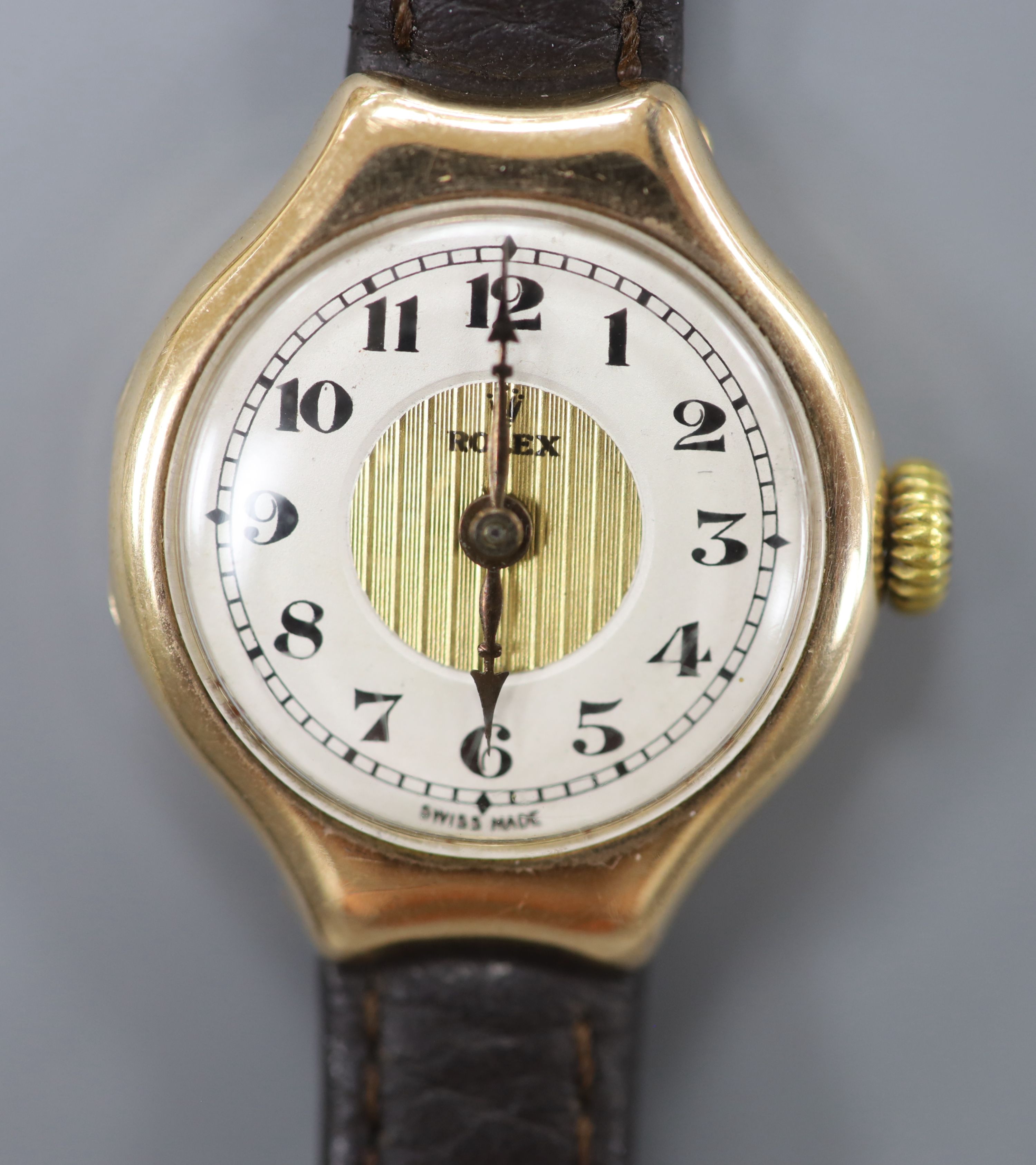 A lady's 1920's 9ct gold Rolex manual wind wrist watch, on associated leather strap, case diameter