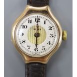 A lady's 1920's 9ct gold Rolex manual wind wrist watch, on associated leather strap, case diameter