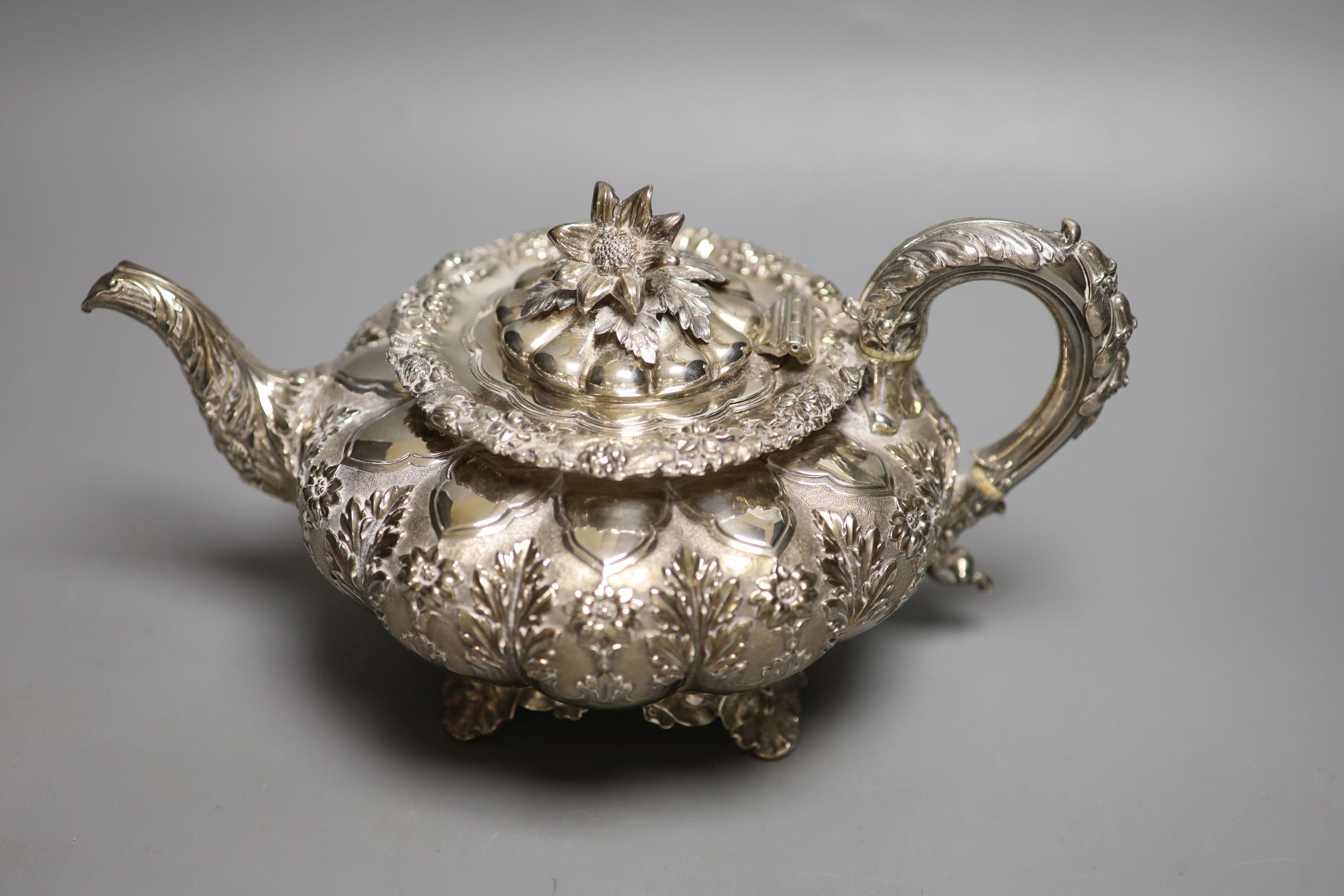 A George IV silver squat melon shaped teapot, embossed with flowers, The Barnards, London, 1829, - Image 2 of 6