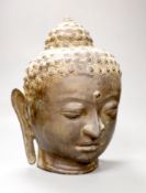 A Sino Tibetan bronze buddha head, height 33cm