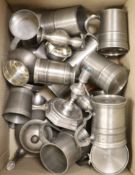 A quantity of pewter tankards, candlesticks etc.