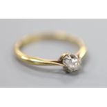 An 18ct and solitaire diamond ring, size Q, gross 2.5 grams, the stone weighing approximately 0.