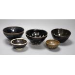 Five Chinese tenmoku glazed bowls, tallest 7cmCONDITION: Structurally good; one dish with