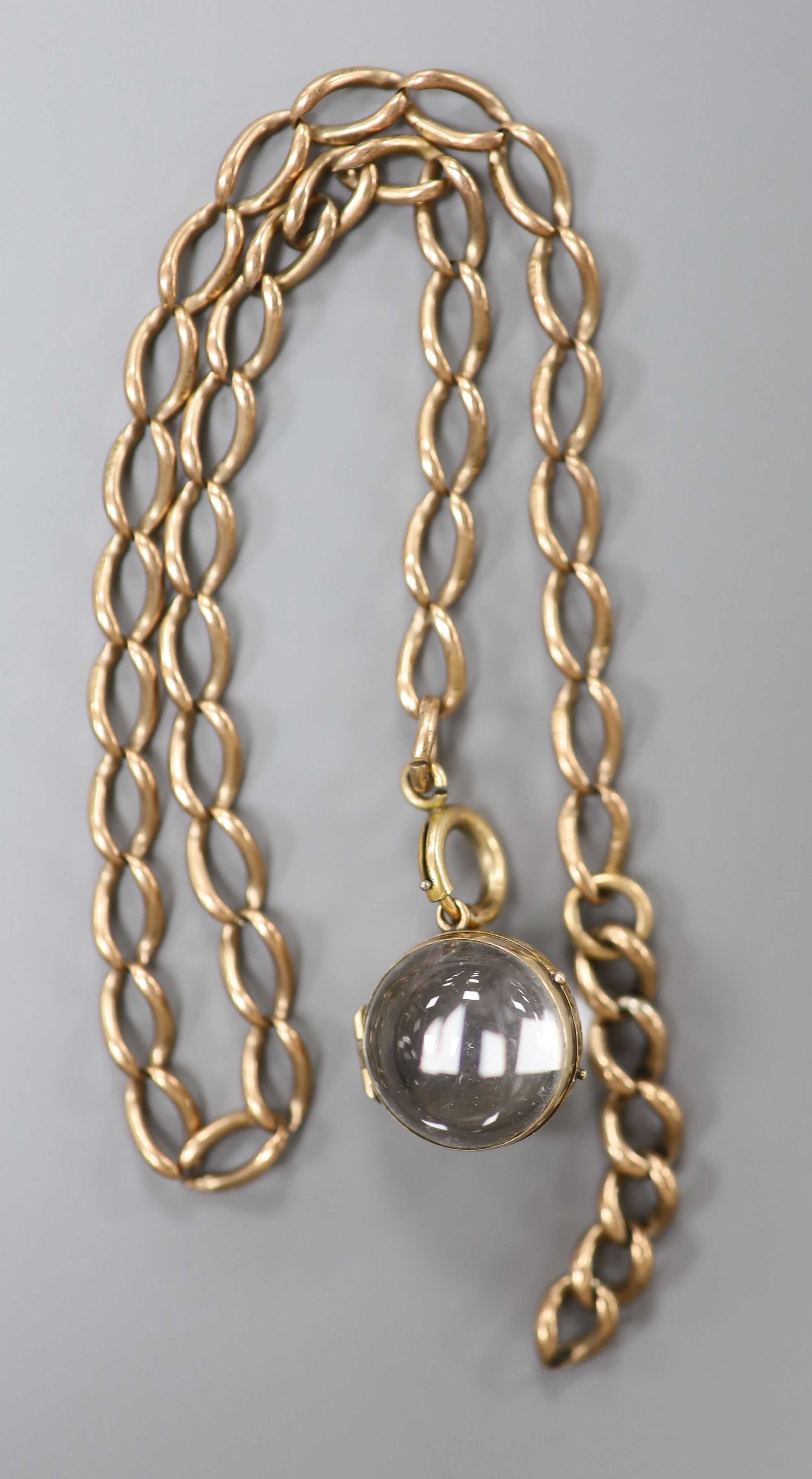 A 9ct gold oval link chain, 35.5cm, 14.5 grams and a yellow metal mounted bullseye pendant locket. - Image 2 of 2