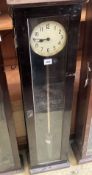 A Pul-Syn-Etic Impulse electric master clock in a beech case, with label for date and manufacture,