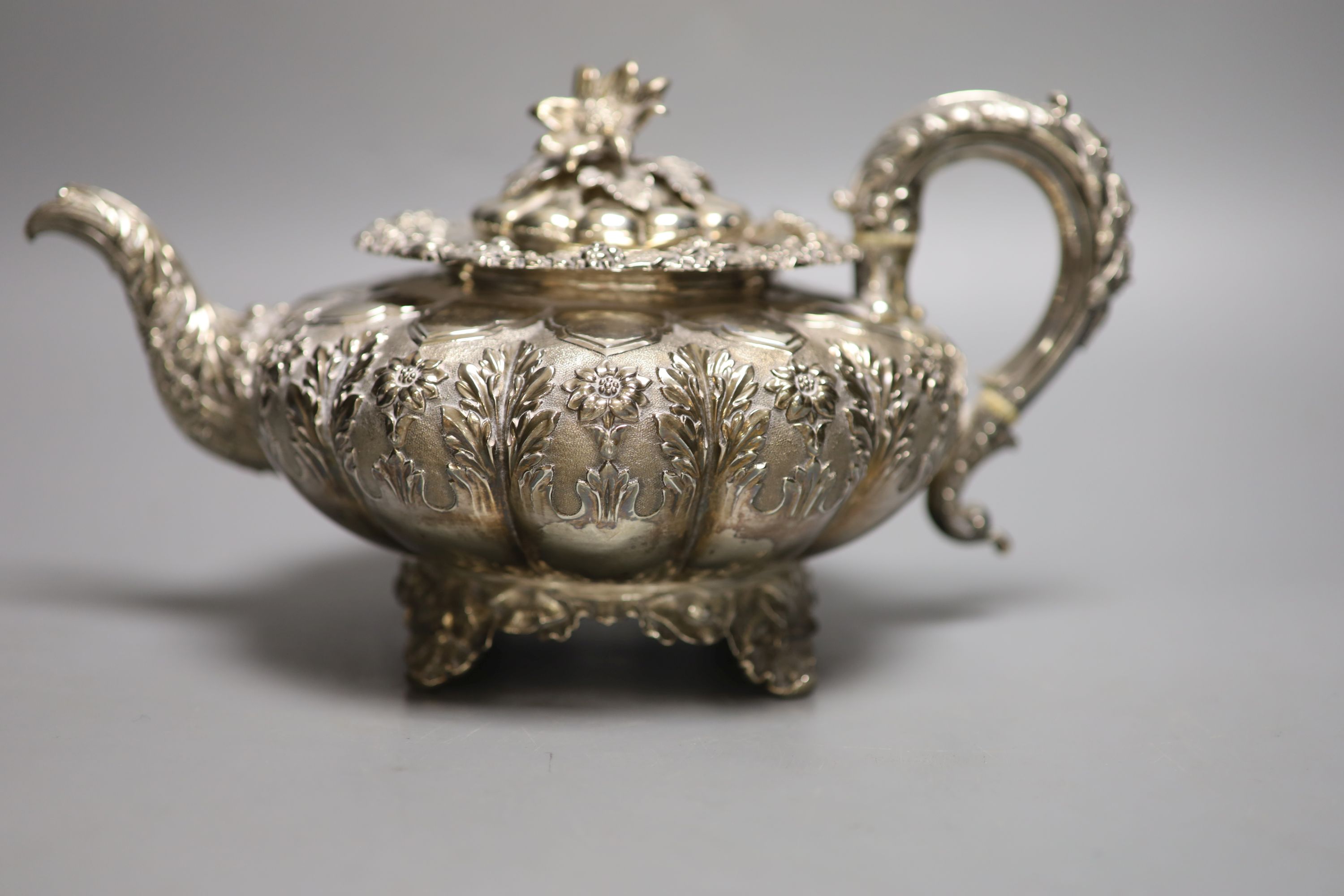 A George IV silver squat melon shaped teapot, embossed with flowers, The Barnards, London, 1829, - Image 3 of 6