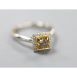 A modern platinum and single stone square modified brilliant cut natural dark yellowish brown