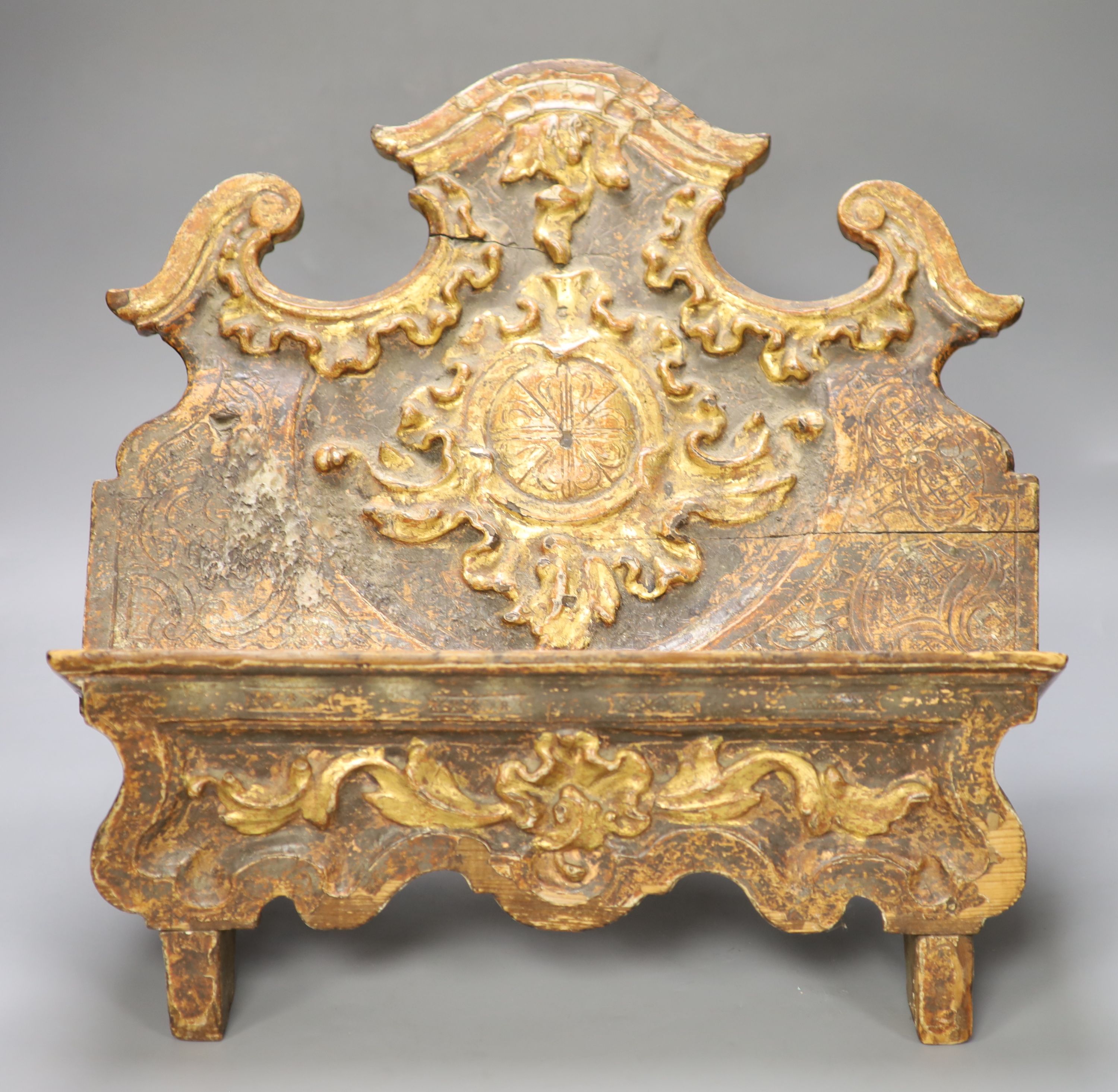 An 18th century Spanish carved and gilded book stand, width 42cm height 37cm