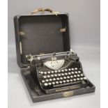 An early 20th century Underwood Elliott Fisher Ltd portable cased typewriter