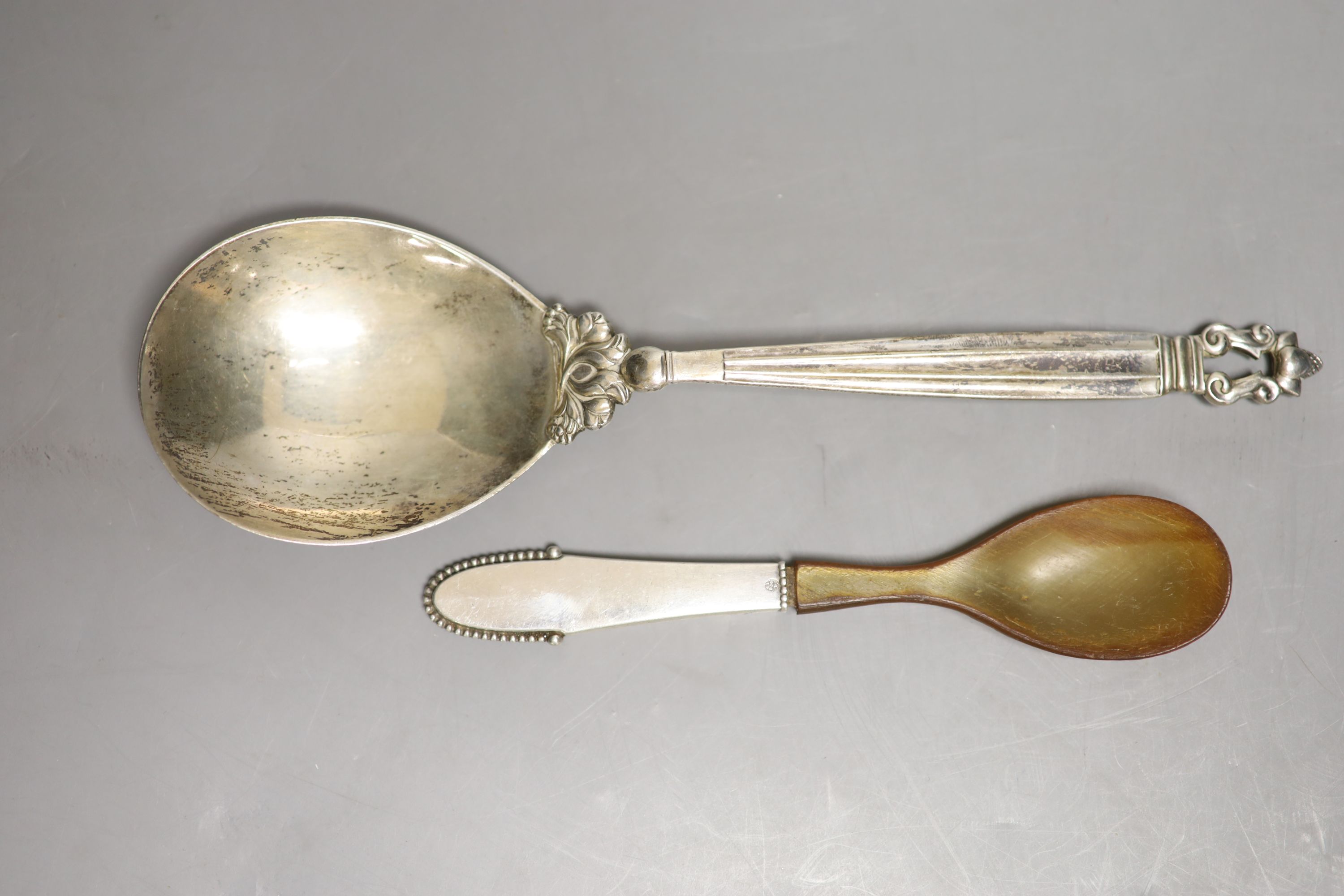 A 1920's Georg Jensen sterling Acorn pattern serving spoon, 23cm and one other Jensen spoon with