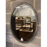 An Irish style oval wall mirror, width 58cm, height 76cm