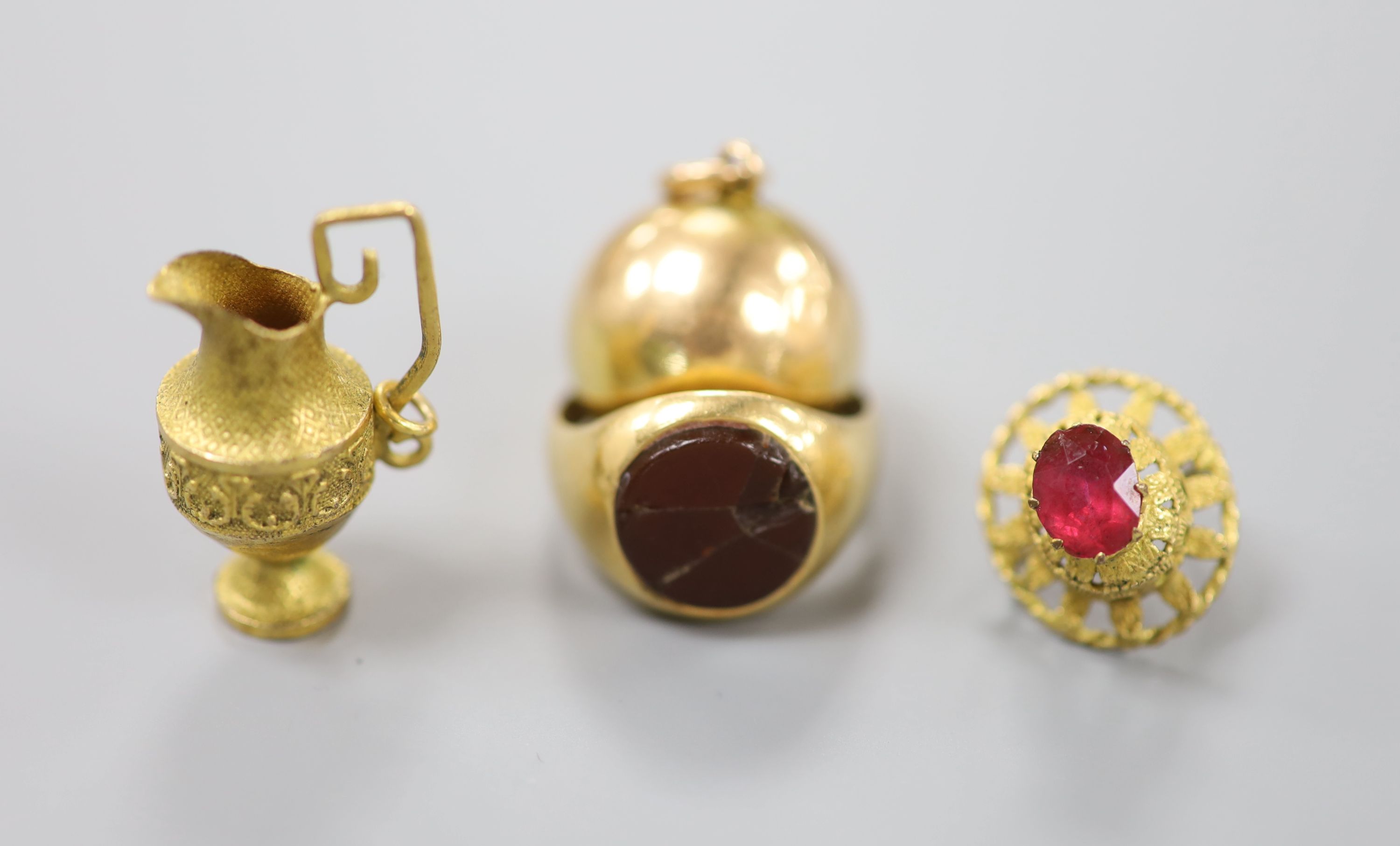 An 18ct and hardstone? set signet ring(a.f.), gross 6.4 grams, a yellow metal spherical hinged