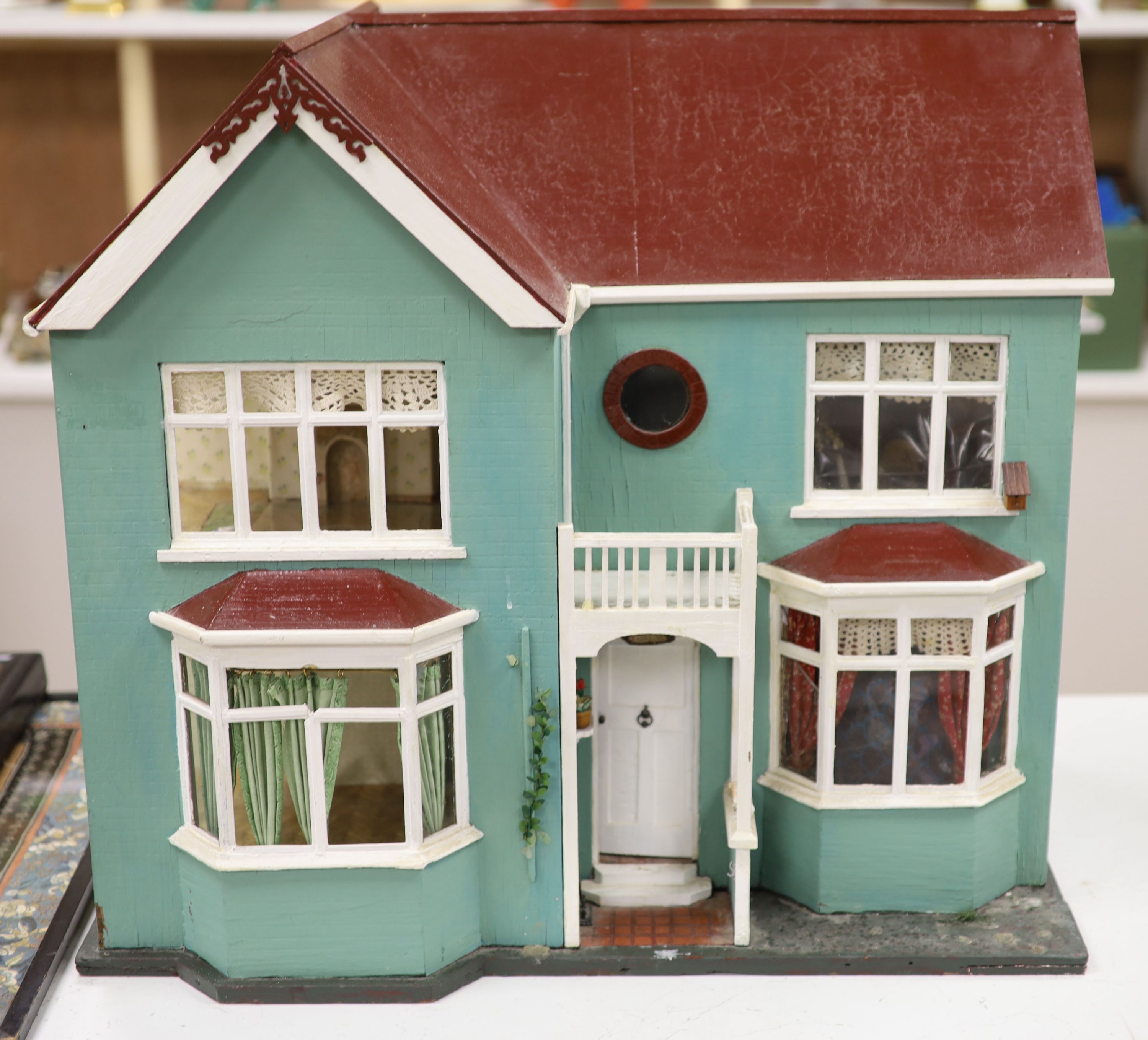 A 1940's doll's house, with contents from Compton Verney Warwickshire, width 63cm height 60cm