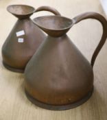 Two graduated copper jugs, one two gallon and other four gallon jugs