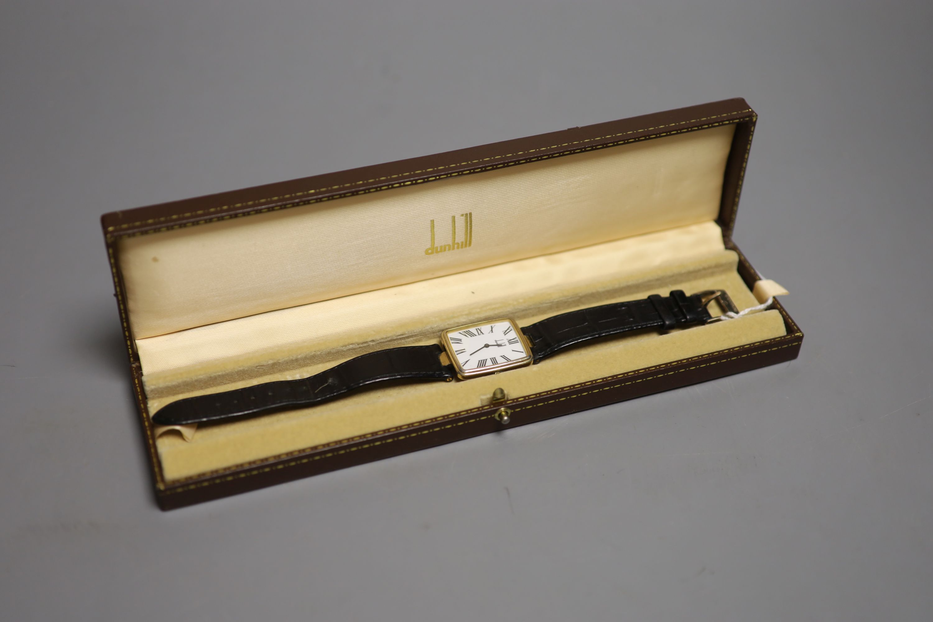 A gentleman's silver gilt Dunhill quartz shaped rectangular dial wrist watch, on a leather strap - Image 2 of 3