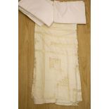 A quantity of linen, including a drawn thread cloth, crochet-edged cloths, damask and sheets