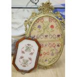 An oval needlework panel and another, largest 39 x 59cm