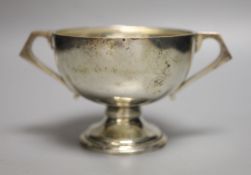 An Anglo-Indian silver two-handled pedestal rose bowl, marked C & K (Cooke & Kelvey), snake and SIL,