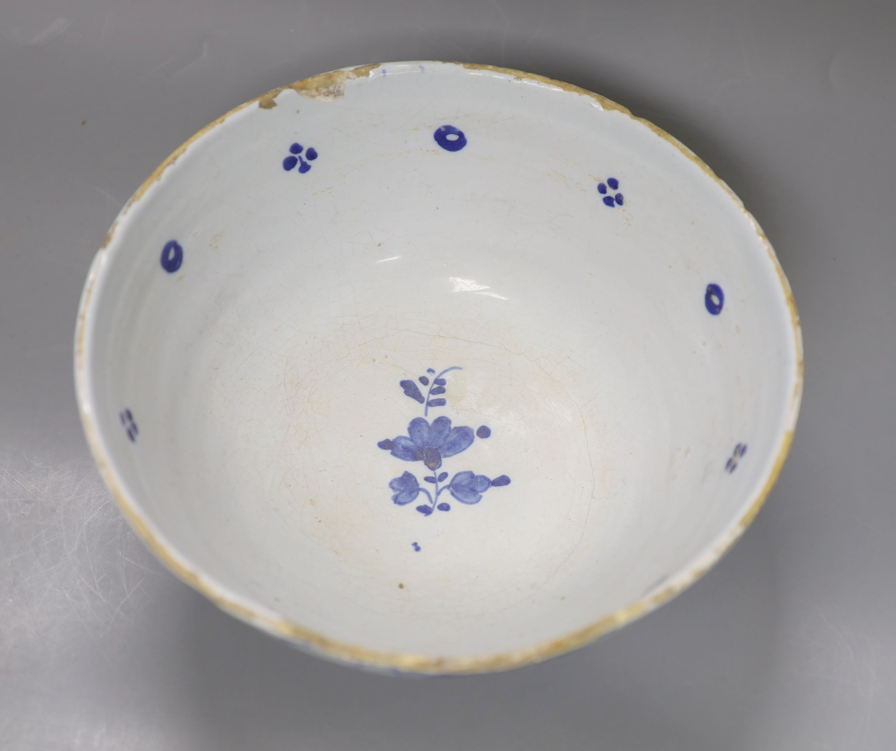 An 18th century English Delft punch bowl, diameter 26cmCONDITION: Bowl - obvious damage includes - Image 4 of 5