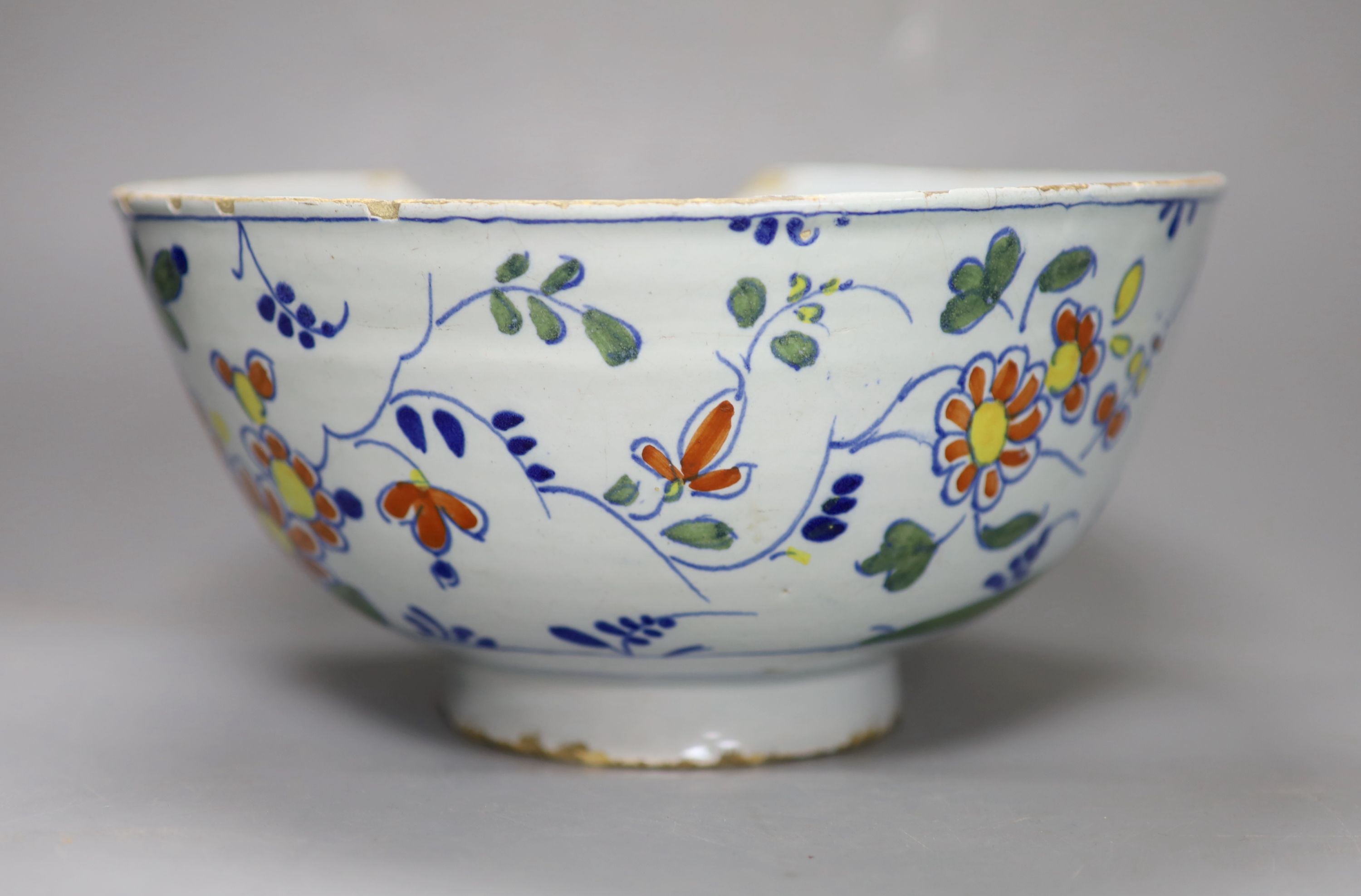 An 18th century English Delft punch bowl, diameter 26cmCONDITION: Bowl - obvious damage includes