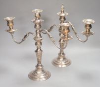 A pair of plated two branch candelabra, height 34cm