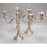 A pair of plated two branch candelabra, height 34cm