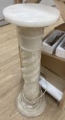 A white carved alabaster pedestal, 80cm high