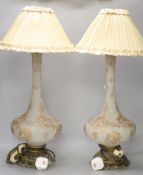 A pair of 19th century French gilt floral decorated frosted glass vases, fitted as table lamps,