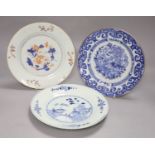Three Chinese Qianlong plates, two blue and white, the third in Imari palette, diameter