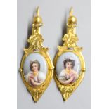 A pair of Victorian style? yellow metal and inset porcelain plaque drop earrings, 52mm, gross 8.4