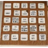 Postal History: A collection of 100 next post enamelled tabs, pre-war, mounted on 4 display boards