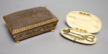 A Tunbridgeware pin cushion and an ivory cased manicure set