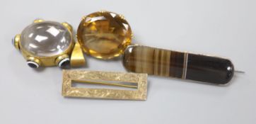 An early 20th century yellow metal mounted citrine brooch, 30mm, gross 19.1 grams, tow other