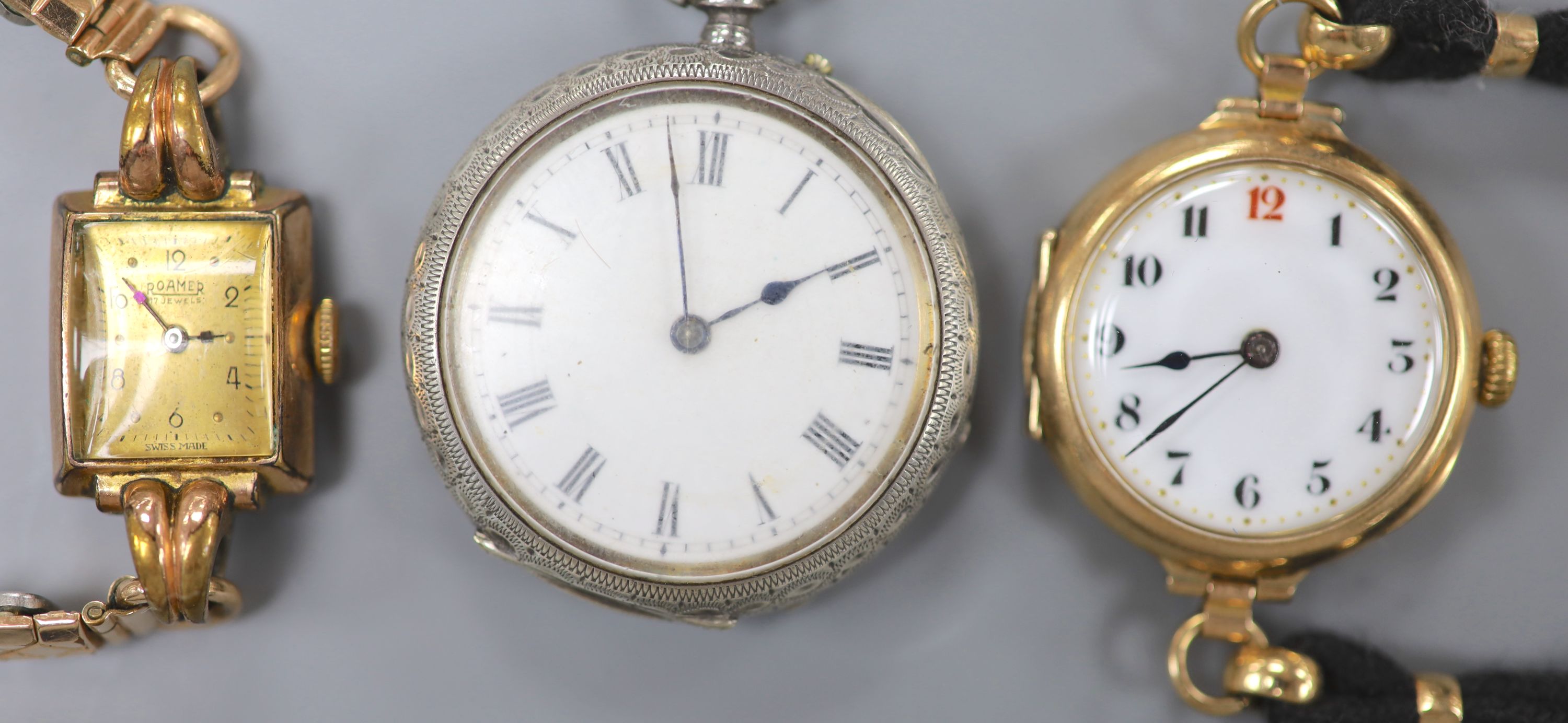 An early 20th century 9ct gold manual wind wrist watch, gross 23.9 grams, one other watch and a