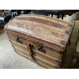 A late Victorian domed top travelling trunk, length 86cm, depth 52cm, height 64cm