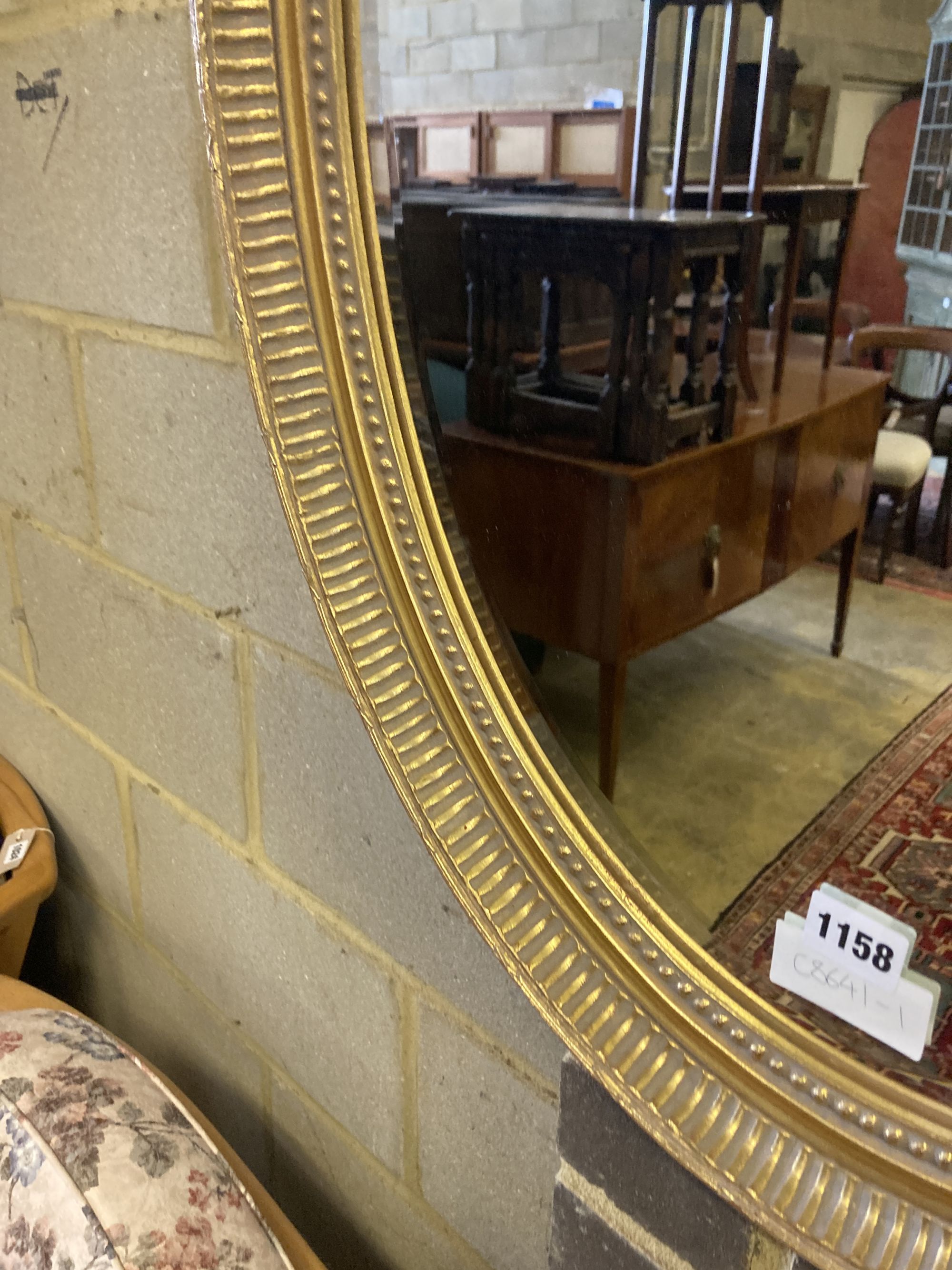 An oval gilt framed bevelled wall mirror, width 58cm height 78cm - Image 3 of 3