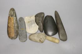 A group of stone adze hand tools, three 19th century Papua New Guinea, each labelled New Guinea,