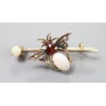 A Victorian yellow and white metal, white opal, garnet and seed pearl set bug brooch, 37mm, gross