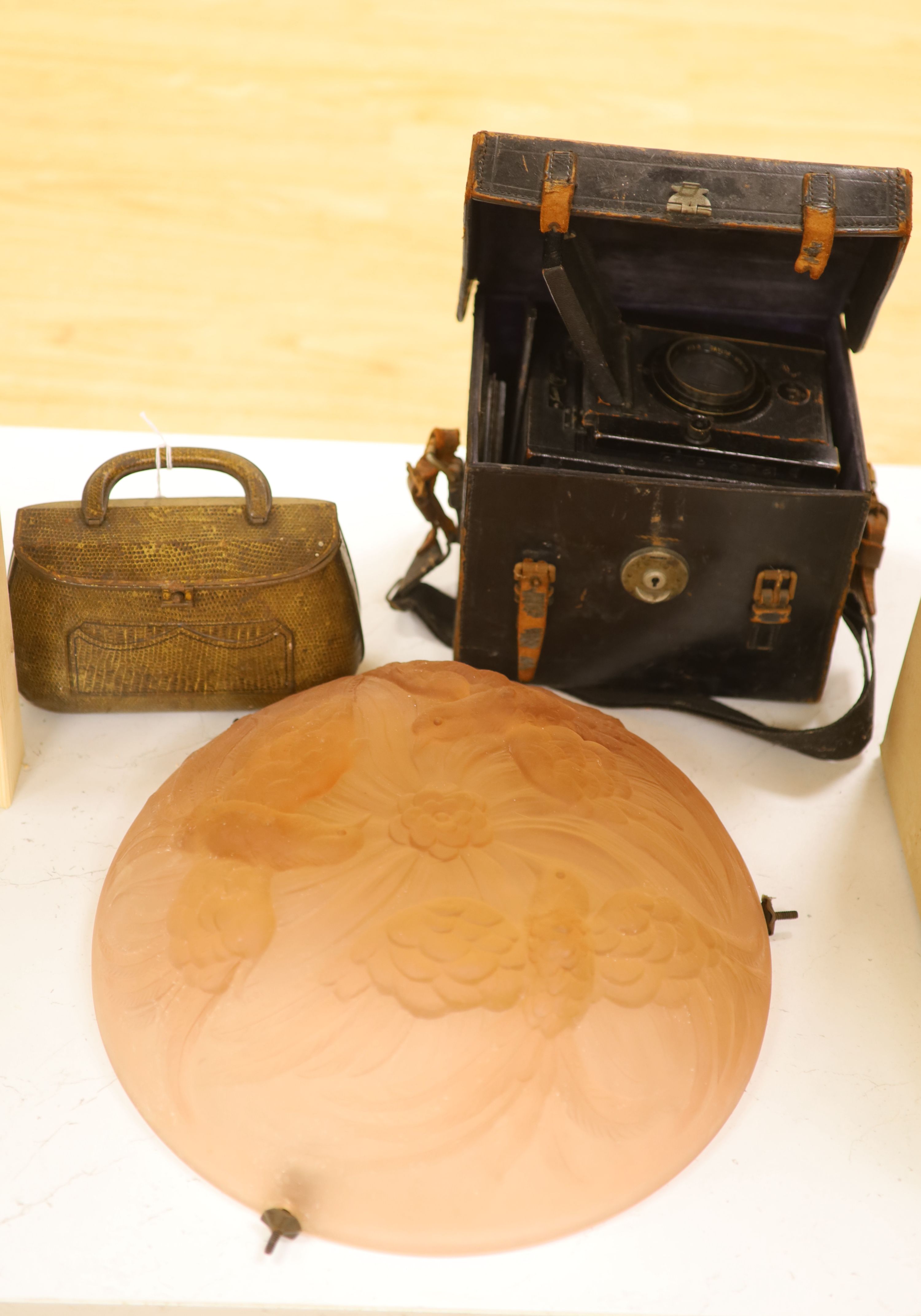 A Taylor & Hobson lens camera, a plaffonier and a tin 'handbag' box