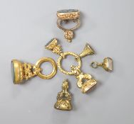 Four assorted 19th century yellow metal overlaid and carnelian set fob seals including one with