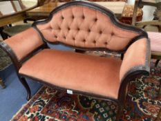 A mahogany framed two seater settee, with pink buttoned upholstery, c.1890, length 110cm, depth